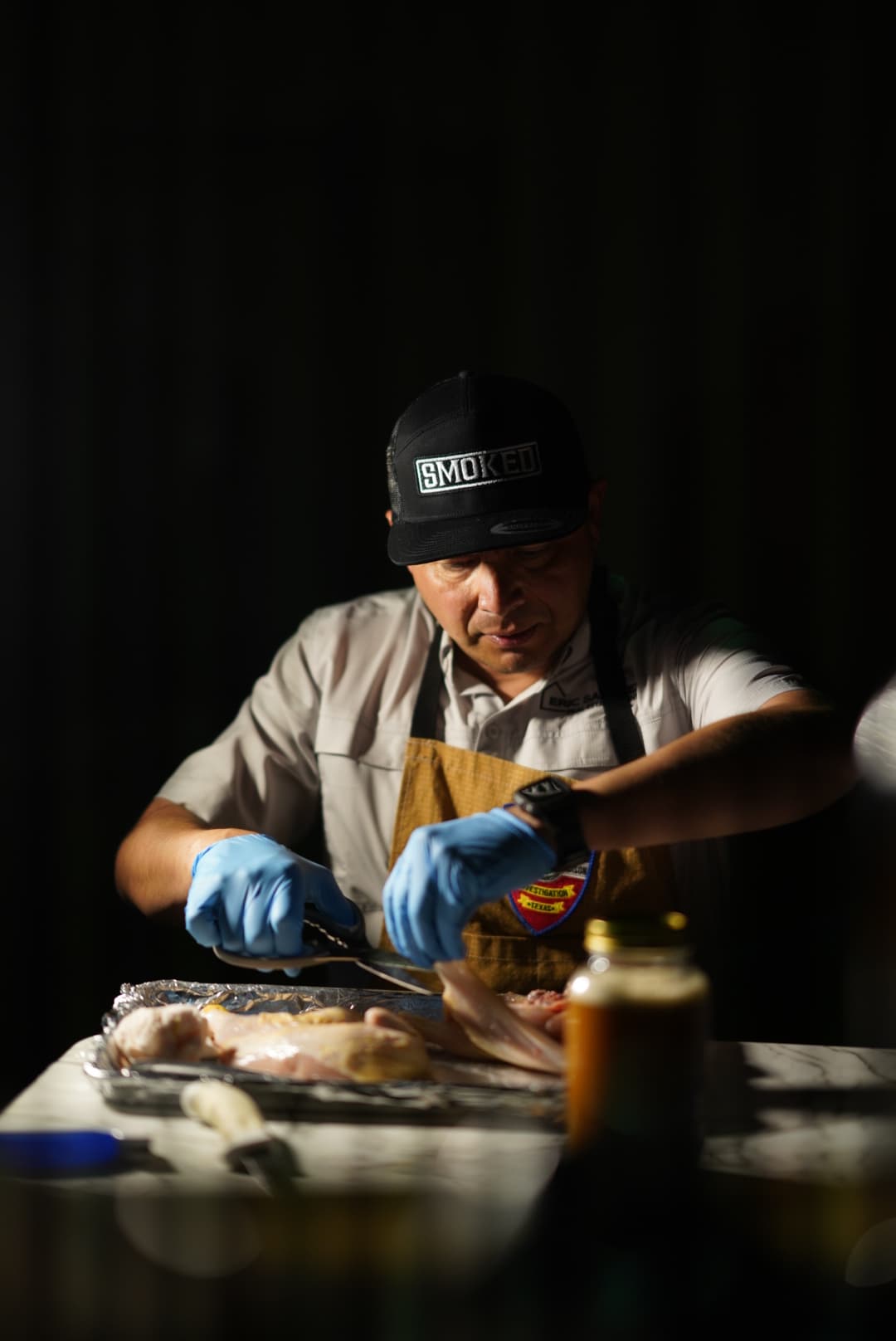 Smoked BBQ Apparel founder at the pit